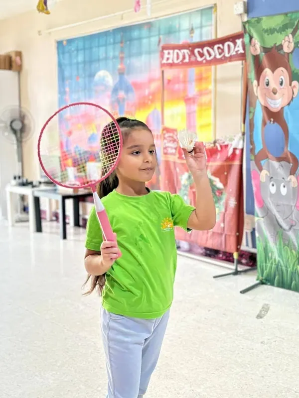 A child playing badminton during an activity at Nurtaqwa Kindergarten.